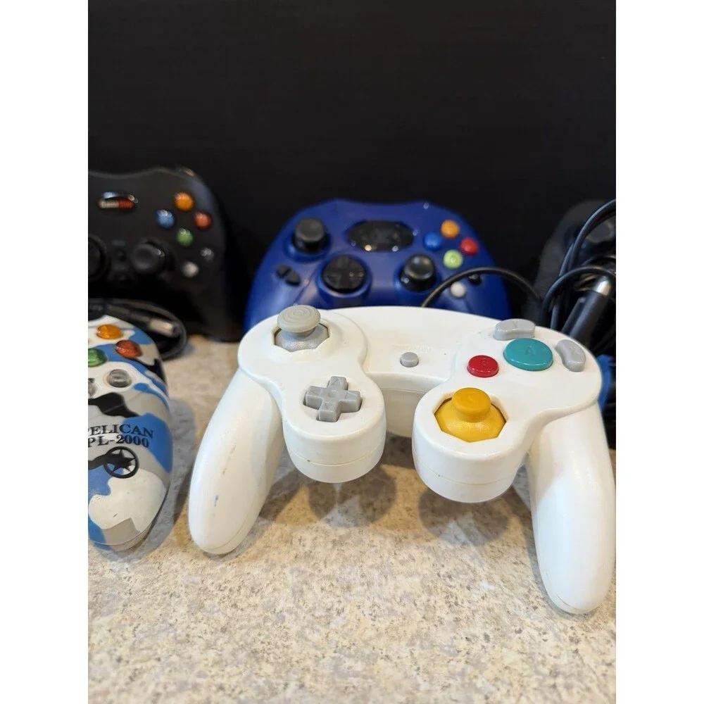 Lot of 7 Mixed Video Game Controllers GameCube Xbox PS Untested Pelican GameStop